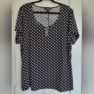 Elegant Black and White Polka Dot Blouse With Gold Accent